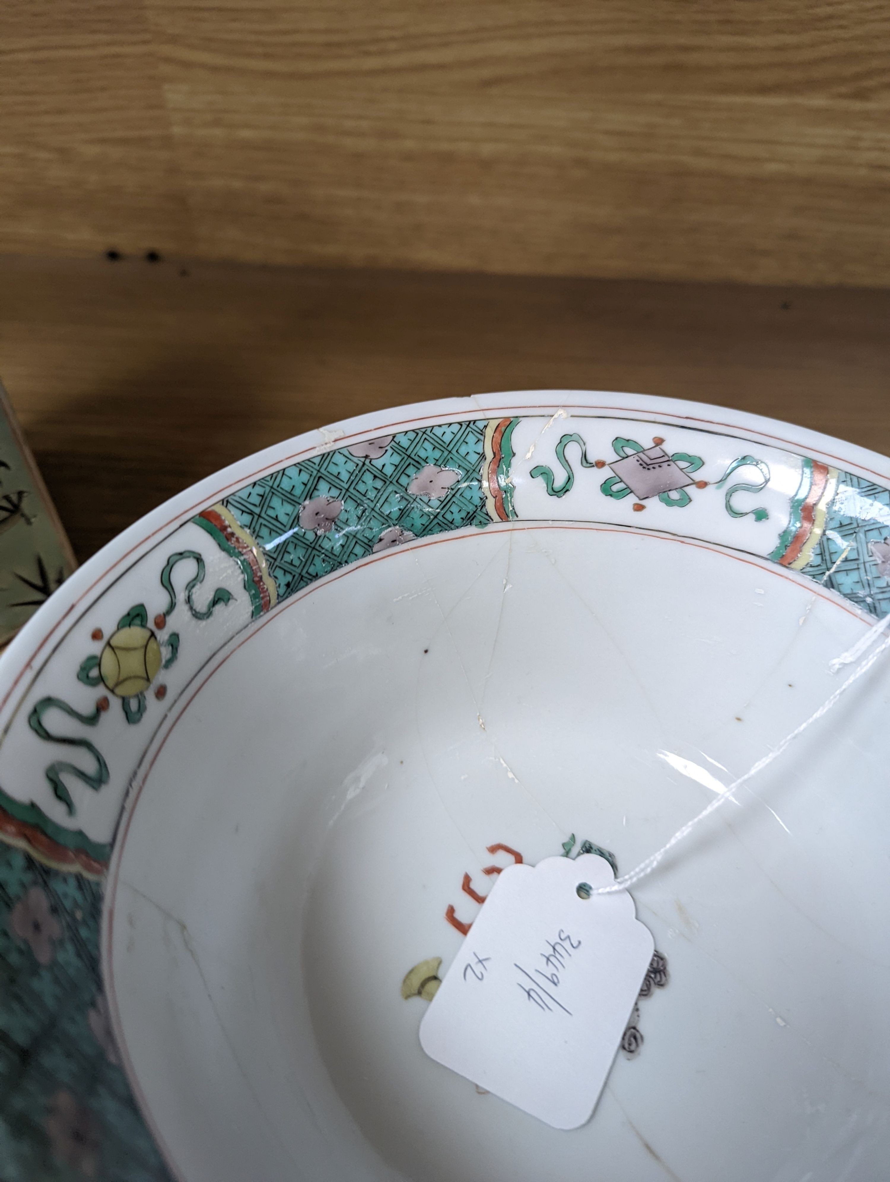 A Kangxi famille verte bowl, 20cm (a.f.) and a Chinese Dowager Empress-pattern pillow with dragons